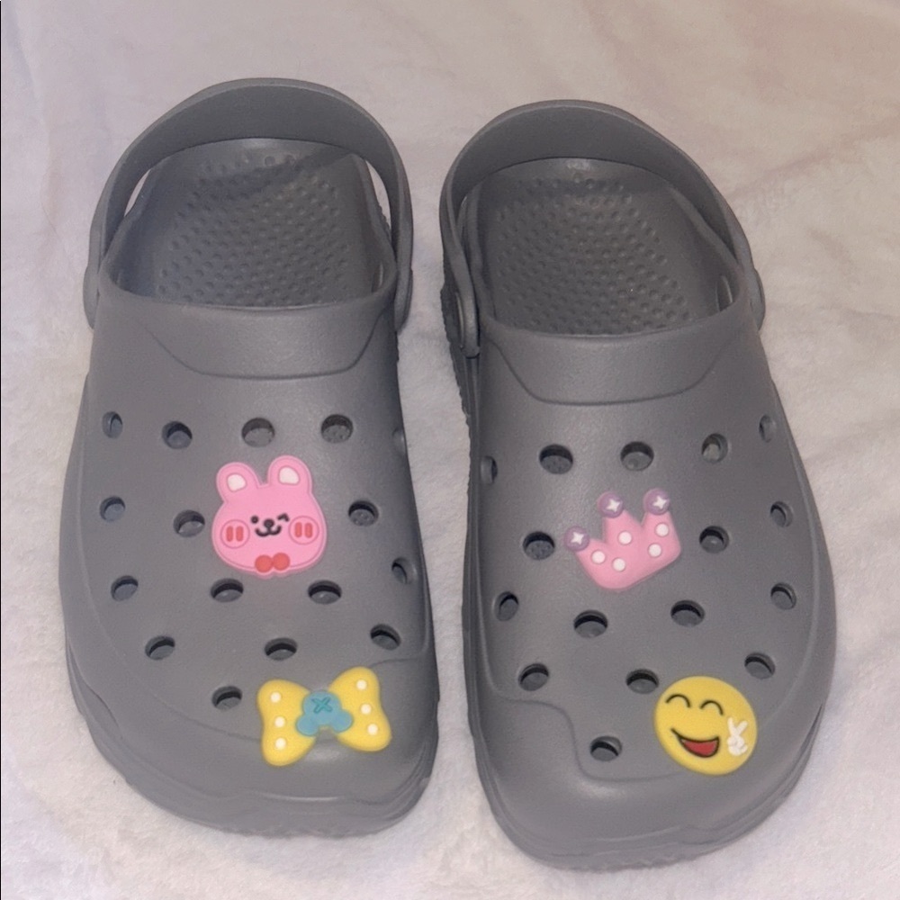 Grey Crocs clogs with Fun Jibbitz Charms